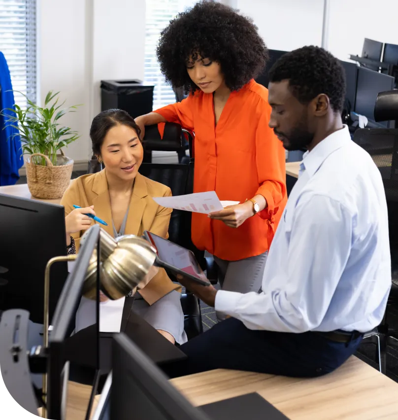 A group of coworkers collaborate in an office setting