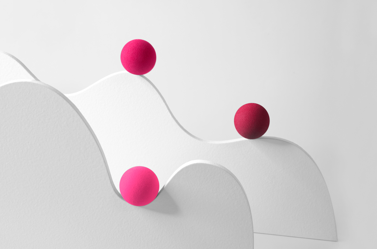 an abstract depiction of 3 spheres moving along a wavy surface