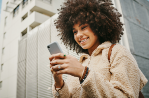 A credit union member viewing her lending options on her mobile device.