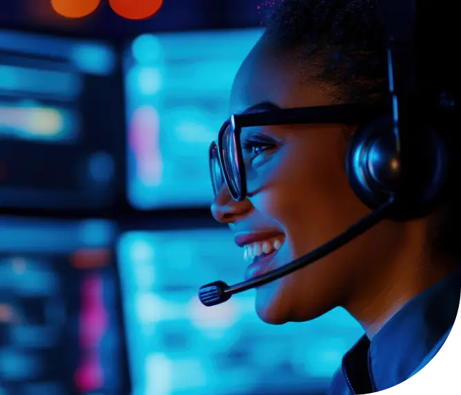 A smiling female customer service representative wearing a phone headset