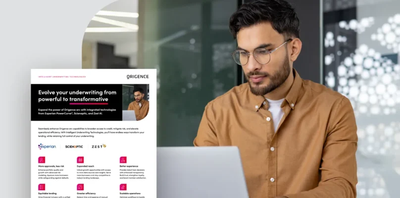 A man uses a laptop in an office setting