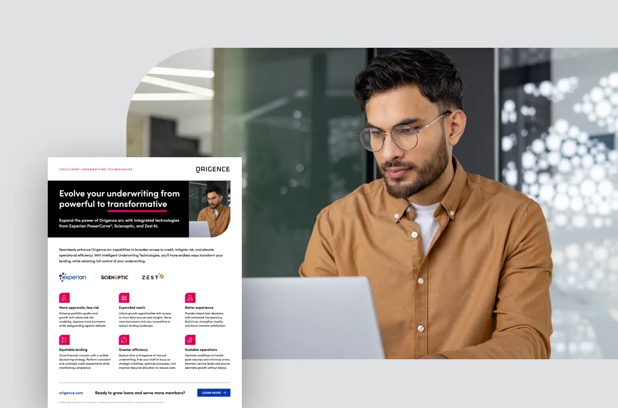 A man uses a laptop in an office setting