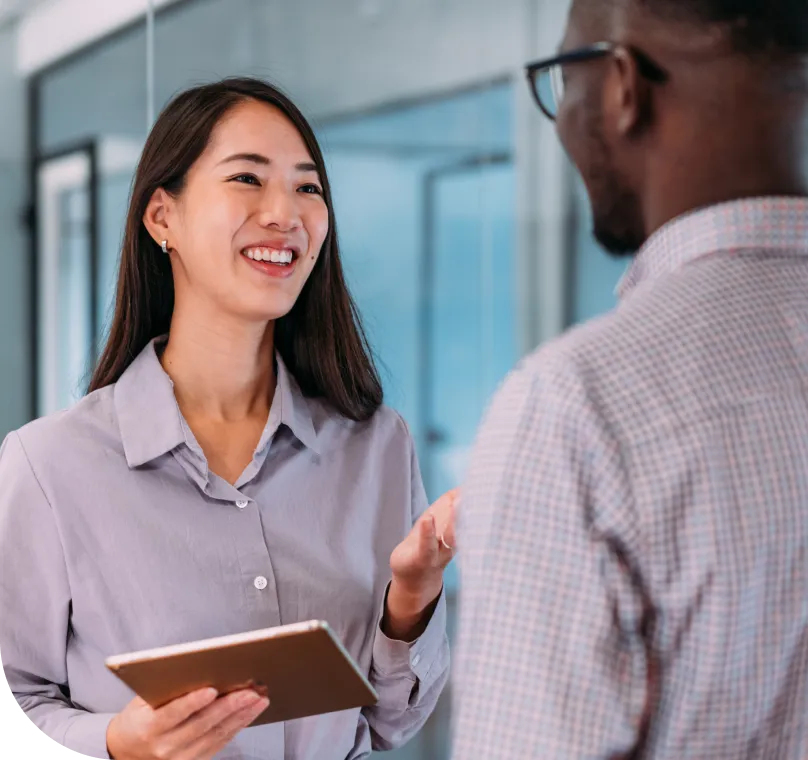 coworkers converse in an office