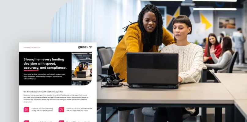 Two women collaborate and use a laptop computer in an office environment