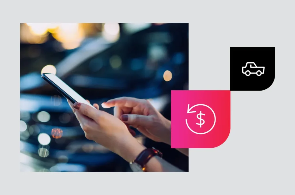 A woman holds a smart phone near a vehicle lot