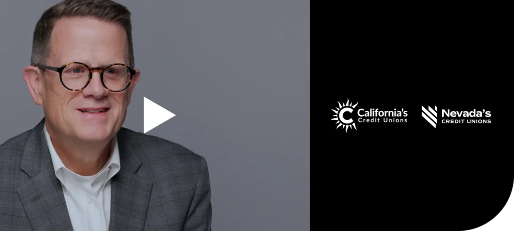 A photo of Scott Simpson with a play button overlayed